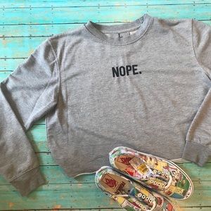 {atmosphere} “nope.” crop sweater